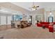 Open-concept living room offering views of the kitchen, dining area, and comfortable seating at 7030 Mandevilla Ln, Douglasville, GA 30135