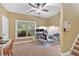 Spacious office room featuring a large window, carpet floor, and built-in shelves at 7030 Mandevilla Ln, Douglasville, GA 30135
