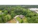 Charming single-Gathering home nestled in lush greenery with a long driveway at 799 Wagon Trl, Woodstock, GA 30188