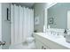 Clean bathroom with a shower, a well-lit vanity area and white marble floors at 799 Wagon Trl, Woodstock, GA 30188