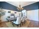 Stately dining room with a large table, seating for six, and an open view to the kitchen at 799 Wagon Trl, Woodstock, GA 30188