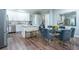 Bright kitchen with white cabinets, stainless steel appliances, and a breakfast bar at 799 Wagon Trl, Woodstock, GA 30188