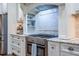 Modern kitchen features granite countertops, stainless steel appliances, and custom cabinets with tile backsplash at 799 Wagon Trl, Woodstock, GA 30188