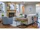 Comfortable living room features a stone fireplace, built-in cabinets, and plenty of natural light at 799 Wagon Trl, Woodstock, GA 30188
