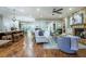 Open-concept living space includes a fireplace, hardwood floors, and seamless flow to the kitchen and dining area at 799 Wagon Trl, Woodstock, GA 30188