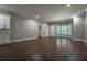 Large living area with natural light, featuring tile backsplash and hard wood floors at 799 Wagon Trl, Woodstock, GA 30188