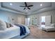 Spacious main bedroom with tray ceiling, sitting area, and ensuite bathroom at 799 Wagon Trl, Woodstock, GA 30188