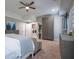 Comfortable bedroom with a view to a laundry room featuring modern washer and dryer at 799 Wagon Trl, Woodstock, GA 30188