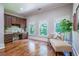 Bright home office with built-in desk, hardwood floors, and an abundance of natural light at 799 Wagon Trl, Woodstock, GA 30188