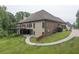 Beautiful home featuring a large backyard with deck, greenery and an exterior made of brick at 799 Wagon Trl, Woodstock, GA 30188