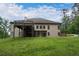 Beautiful home featuring a large backyard with deck, greenery and an exterior made of brick at 799 Wagon Trl, Woodstock, GA 30188