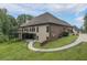Beautiful home featuring a large backyard with deck, greenery and an exterior made of brick at 799 Wagon Trl, Woodstock, GA 30188