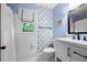 Modern bathroom featuring a shower with a white curtain, decorative wallpaper and a large window at 1104 Warrenhall Ne Ln, Brookhaven, GA 30319