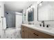 Modern bathroom featuring dual sinks, wood vanity, and tiled shower/tub at 1104 Warrenhall Ne Ln, Brookhaven, GA 30319