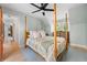 Relaxing bedroom featuring a four-poster bed, a ceiling fan and an elegant view of the dresser at 1104 Warrenhall Ne Ln, Brookhaven, GA 30319