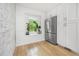 Bright kitchen nook with stainless steel refrigerator, white cabinets, and natural light at 1104 Warrenhall Ne Ln, Brookhaven, GA 30319
