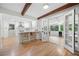 Modern kitchen featuring a breakfast bar with views into the sunroom at 1104 Warrenhall Ne Ln, Brookhaven, GA 30319