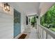 Inviting front porch with blue door and rocking chairs at 1104 Warrenhall Ne Ln, Brookhaven, GA 30319