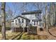 Back of the house features a spacious deck and stairs leading down to a lush, green backyard at 3271 Sutcliffe Nw Rdg, Marietta, GA 30064
