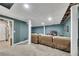 Finished basement featuring a drop ceiling, a large tv, and beige walls at 3271 Sutcliffe Nw Rdg, Marietta, GA 30064