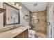 Modern bathroom featuring a glass shower, granite countertops, and neutral tile at 3271 Sutcliffe Nw Rdg, Marietta, GA 30064