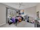 Bedroom featuring a bright rainbow theme, a ceiling fan, and a window with natural light at 3271 Sutcliffe Nw Rdg, Marietta, GA 30064