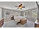 Serene bedroom featuring neutral paint, carpet, ceiling fan, and windows at 3271 Sutcliffe Nw Rdg, Marietta, GA 30064