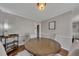 A different angle of the dining room features a wood table and a display cart at 3271 Sutcliffe Nw Rdg, Marietta, GA 30064