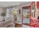 Welcoming entryway with a bright red door leading to a cozy interior, complemented by natural light and stylish decor at 3271 Sutcliffe Nw Rdg, Marietta, GA 30064
