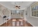 Bright living area with hardwood floors, a ceiling fan, and many windows for ample natural light at 3271 Sutcliffe Nw Rdg, Marietta, GA 30064