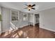 Well-lit living area with hardwood floors, windows, and ceiling fan at 3271 Sutcliffe Nw Rdg, Marietta, GA 30064
