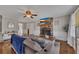 Comfortable living room features a brick fireplace, hardwood floors, and ample natural light, creating a warm atmosphere at 3271 Sutcliffe Nw Rdg, Marietta, GA 30064