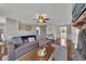 Spacious living room with a brick fireplace, hardwood floors, and a comfortable sectional, ideal for Gathering gatherings at 3271 Sutcliffe Nw Rdg, Marietta, GA 30064