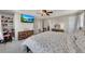 Spacious main bedroom features a ceiling fan, TV, dresser, and a large window for natural light at 3271 Sutcliffe Nw Rdg, Marietta, GA 30064