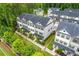 Aerial view showcasing new construction townhomes with manicured landscaping and sidewalks at 429 Stovall Pl, Woodstock, GA 30188