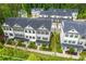 Overhead view of a modern townhome community featuring well-maintained landscaping at 429 Stovall Pl, Woodstock, GA 30188