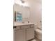 Bright bathroom featuring a single sink vanity, toilet and a shower/tub combo at 429 Stovall Pl, Woodstock, GA 30188