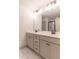 Bright bathroom featuring a double sink vanity, and modern fixtures at 429 Stovall Pl, Woodstock, GA 30188