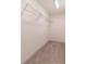 Walk in closet with shelving and carpet at 429 Stovall Pl, Woodstock, GA 30188