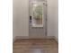 Entryway with gray front door and storm door at 429 Stovall Pl, Woodstock, GA 30188
