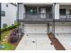 Two-car garage with alley access, located in a modern townhome community at 429 Stovall Pl, Woodstock, GA 30188