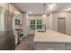 Modern kitchen with stainless steel appliances, sleek countertops, and stylish pendant lighting at 429 Stovall Pl, Woodstock, GA 30188