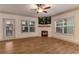 Cozy living area with a modern fireplace and ample natural light, perfect for relaxation at 429 Stovall Pl, Woodstock, GA 30188