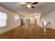 Bright open-concept living area with hardwood floors that seamlessly connects to the kitchen at 429 Stovall Pl, Woodstock, GA 30188