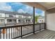 Back patio with a view of neighboring townhomes at 429 Stovall Pl, Woodstock, GA 30188