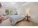 Comfortable bedroom with large window and tray ceiling, providing ample natural light at 514 Augusta Dr, Canton, GA 30115