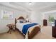 Cozy bedroom with a wood-framed bed, soft lighting, and a serene ambiance at 514 Augusta Dr, Canton, GA 30115