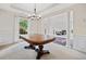 Spacious dining room with elegant chandelier and large window, offering natural light at 514 Augusta Dr, Canton, GA 30115