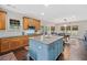 Open kitchen with an island, wooden cabinets, and stainless steel appliances at 514 Augusta Dr, Canton, GA 30115