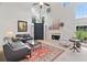Spacious living room featuring large windows, a fireplace, and comfortable seating at 514 Augusta Dr, Canton, GA 30115
